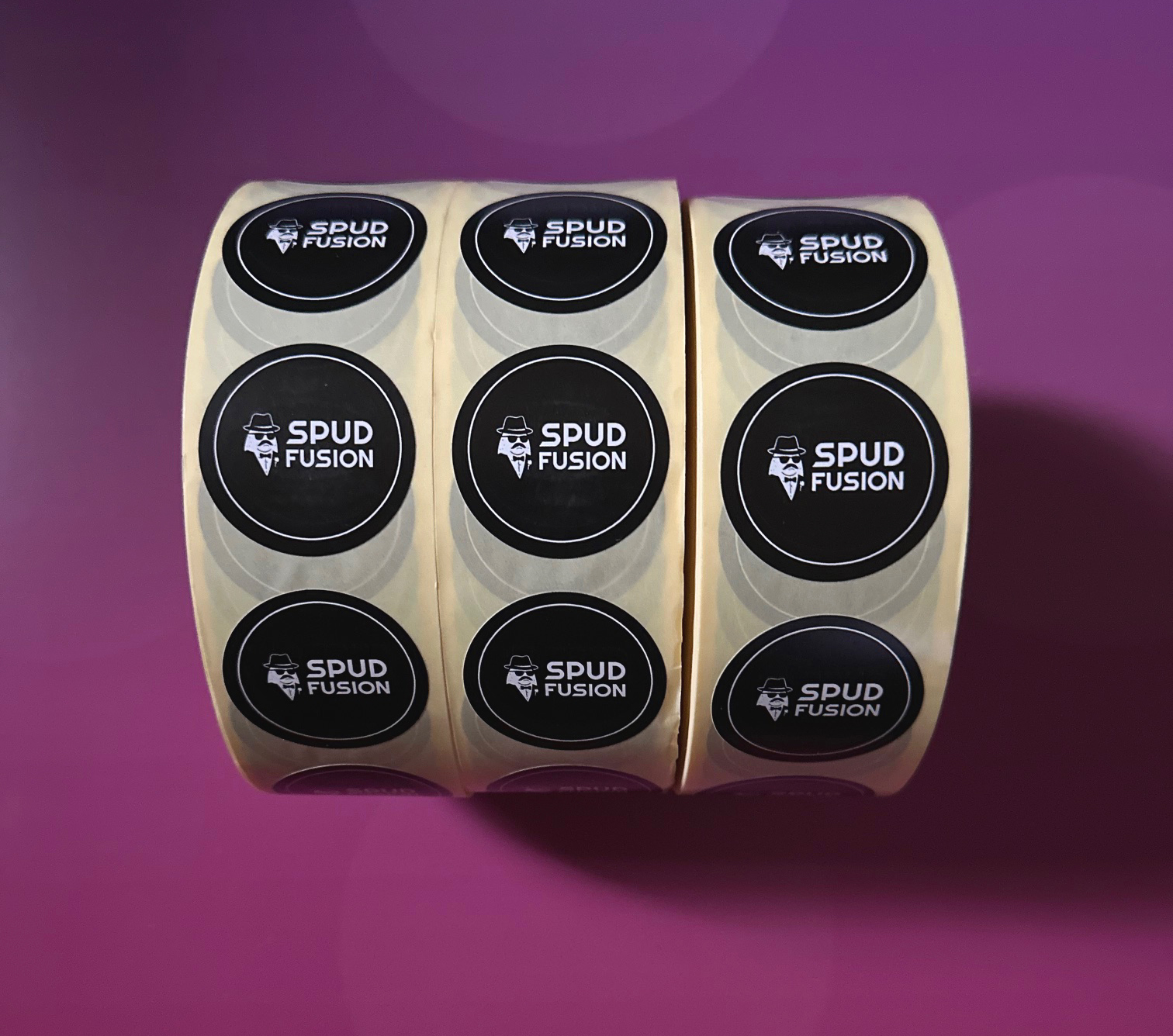 Three rolls of Spud Fusion black circle labels