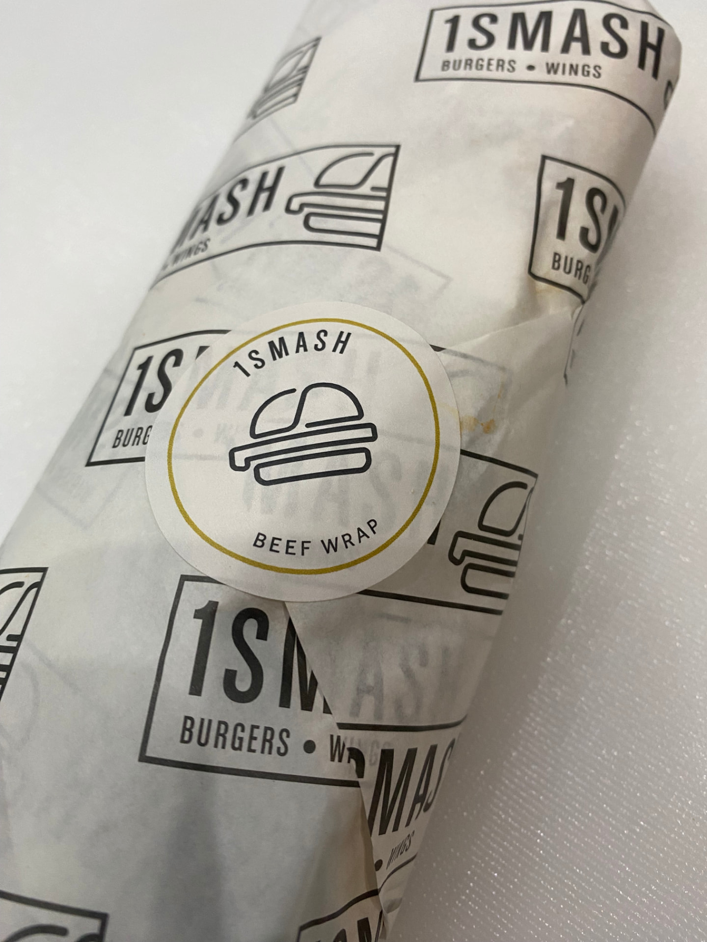 Shake and Grill flavour rolls on a pink surface